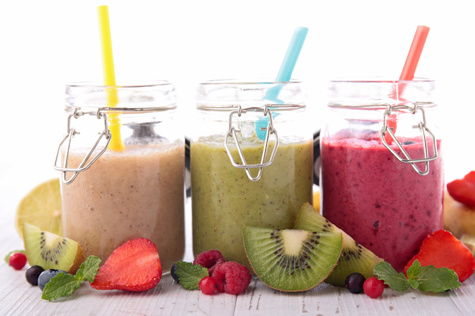 Three jars of colorful smoothies