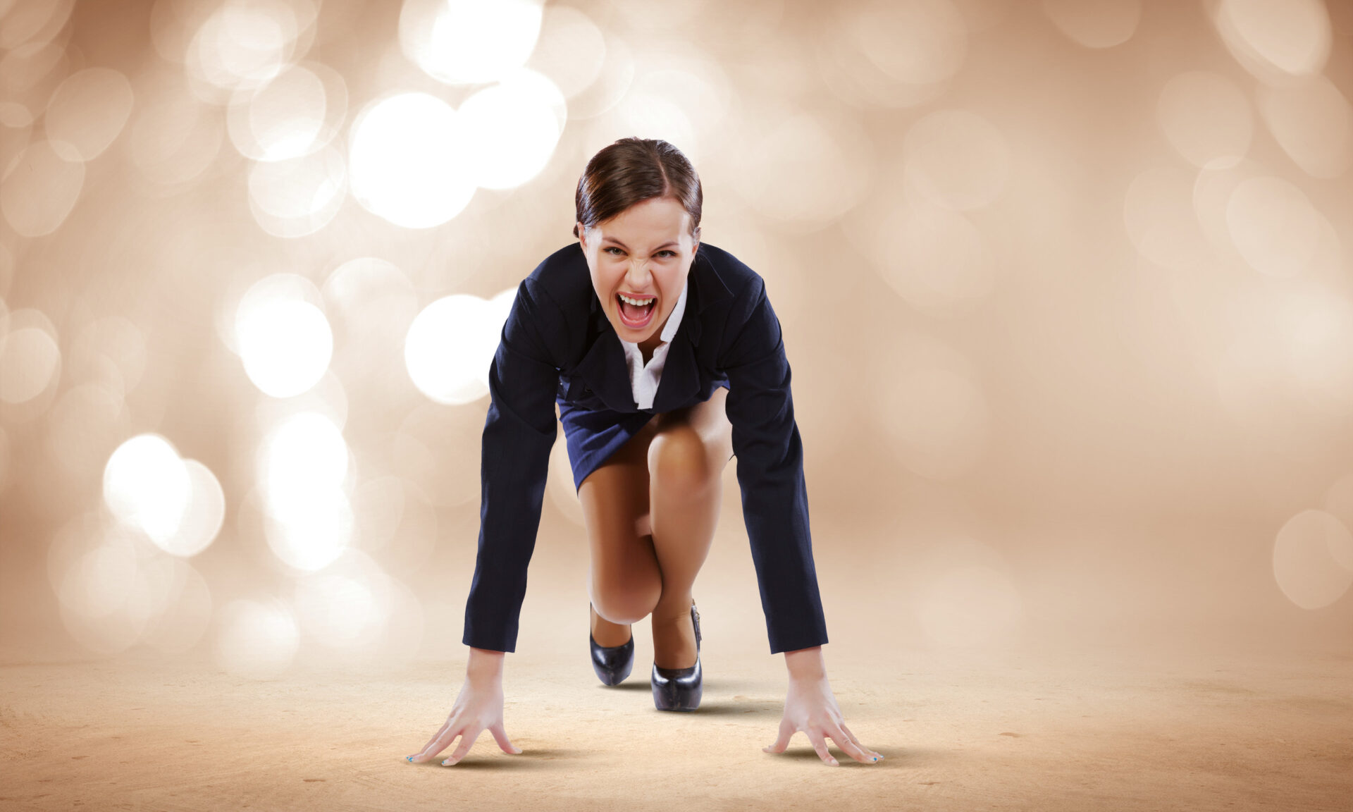 Woman in work clothes gets in starting stance to run