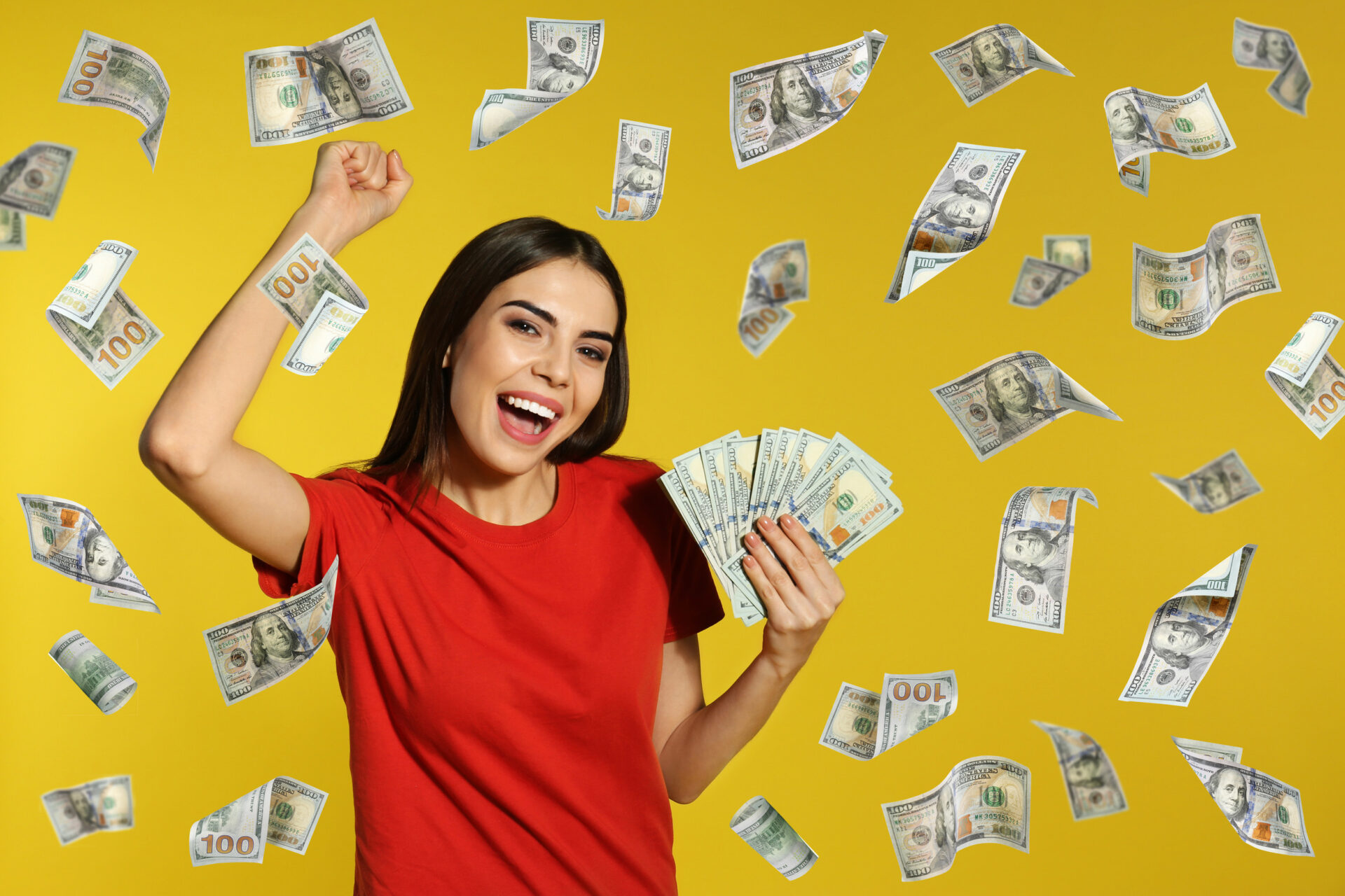 Young woman with money on color background. Space for text